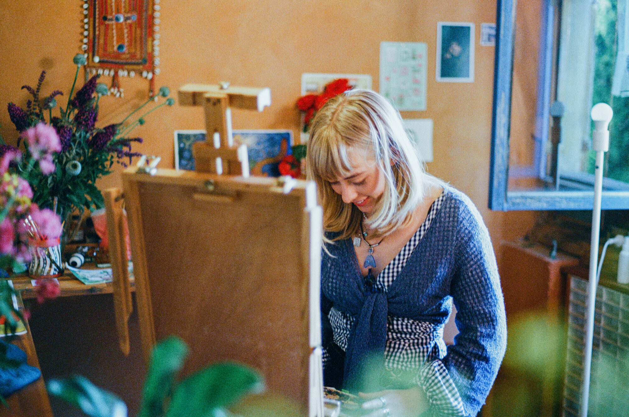 Maya is at work in her colourful studio